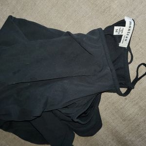 Black shirt, shoulders out, thin material.